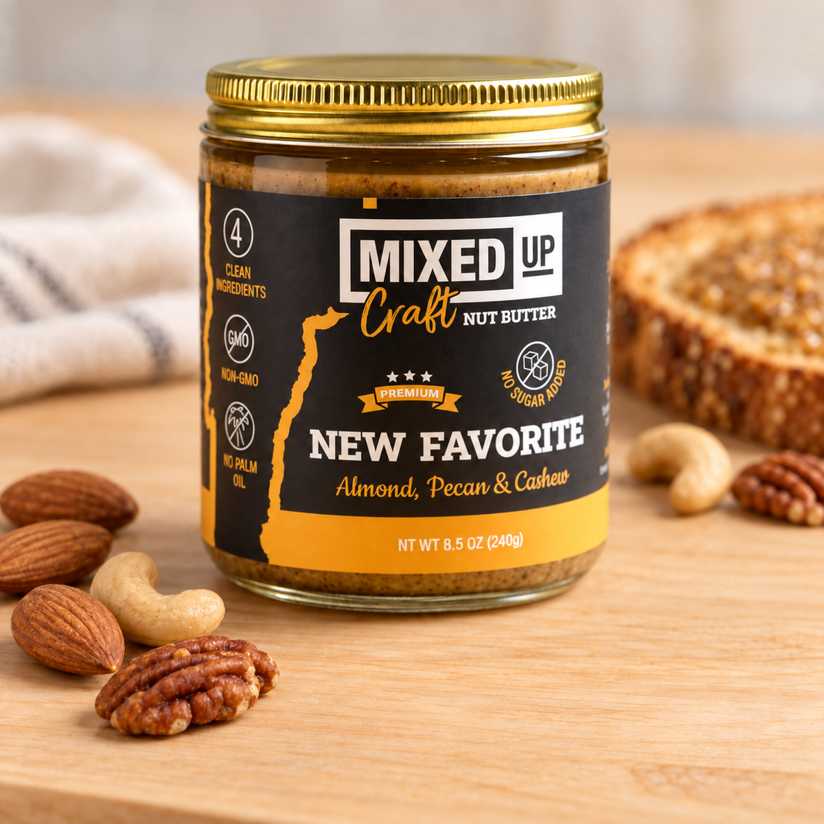 The New Favorite almond, pecan and cashew nut butter 8.5 oz glass jar with almonds, cashews and pecans